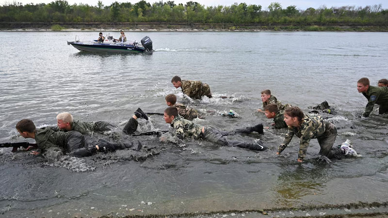 children ran across the sandy banks and shallow waters of the Don River