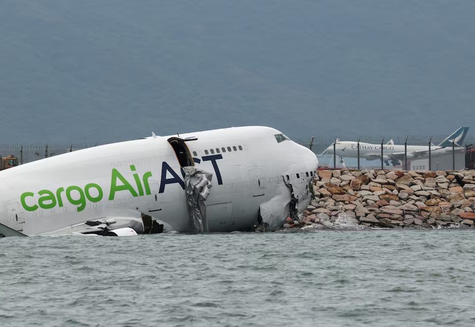 Cargo plane slides off runway in Hong Kong killing two airport staff