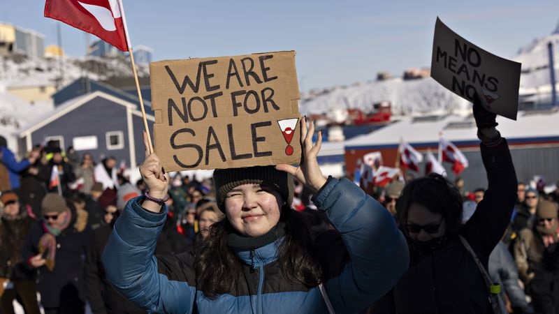 People take part in a march ending in front of the US consulate under the slogan Greenland belongs to the Greenlandic people in Nuuk Greenland