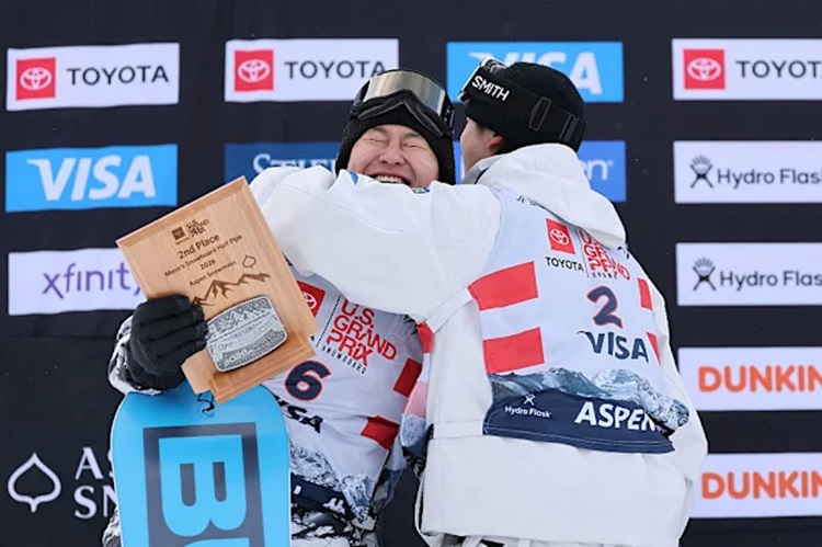 Shuichiro Shigeno L is hugged by teammate Yuto Totsuka R.